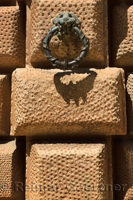 Bronze ring in mouth of lion on the rusticated blocks of Charles V Palace at Alhambra Granada Spain