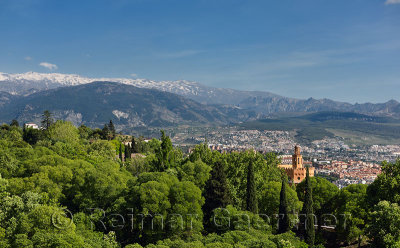 View of Hotel Alhambra Palace from Alcazaba and the snowy Sierra Nevada mountains Granada