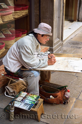 Artist painting the Granada Cathedral of the Incarnation in Pasiegas Square