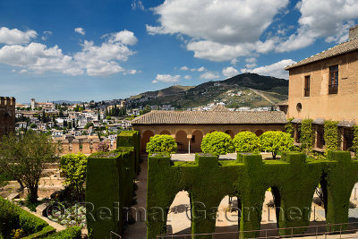 View of Albaicin churches from the garden courtyard of Machuca in Nesrid Palaces of Alhambra Granada