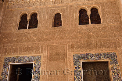 Ornate arabic designs in Mexuar courtyard entrance to the Comares Palace in Nasrid Palaces Alhambra Granada