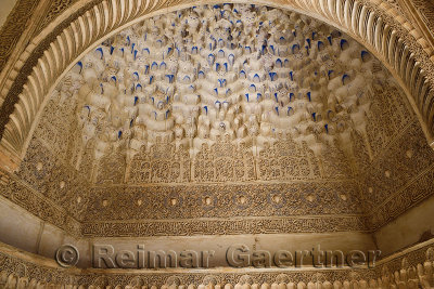 Arch with arabesque caligraphy and Mocarabe honeycomb designs in Comares Palace of Nasrid Alhambra Granada