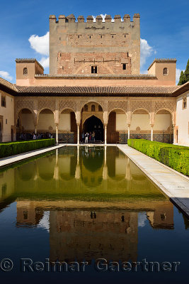 Courtyard of Myrtles pool with Comares Tower reflection in Nasrid Palaces Alhambra Granada