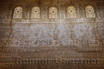 Ornate wall with arabesques in Hall of Ambassadors in the Comares Tower Nasrid Palaces Alhambra Granada