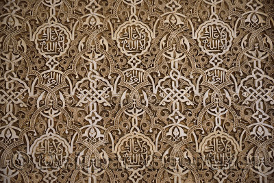 Detail of arabesque wall designs at the courtyard of the Lions of Nasrid Palaces Alhambra Granada
