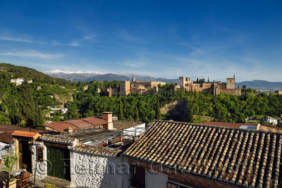 Albaicin restaurant at Saint Nicholas lookout with Generalife Alhambra fortress and Sierra Nevada Mountains Granada