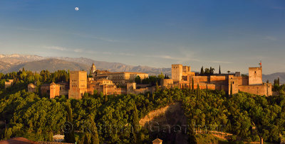 Panorama of hilltop Alhambra Palace fortress complex at sundown Granada