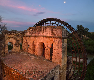 Moonrise over Guadalquivir River with Roman Albolafia Waterwheel at dusk in Cordoba