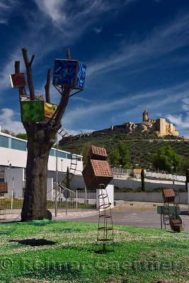 Ancient hilltop Fortress of Mota with Abbey Church and modern sculpture at hospital in Alcala la Real Spain