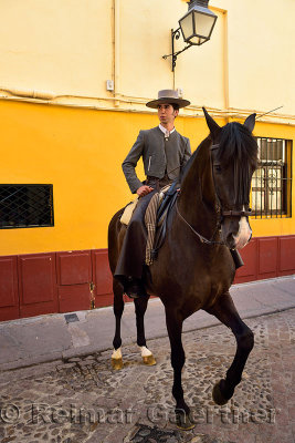 Horse and rider advertising the equestrian Show on Caballerizas street Cordoba