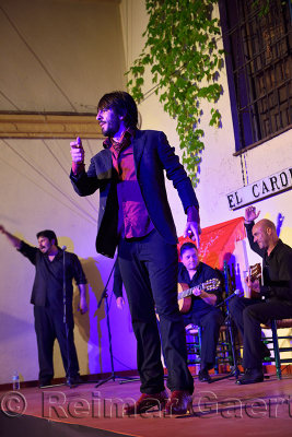 Male Flamenco tap dancer on stage at night in an outdoor courtyard in Cordoba Spain