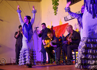 Female Flamenco dancers on stage at night in an outdoor courtyard in Cordoba Spain