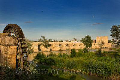 Moonrise over Guadalquivir River with Albolafia Waterwheel Roman Bridge and Calahorra Tower Cordoba