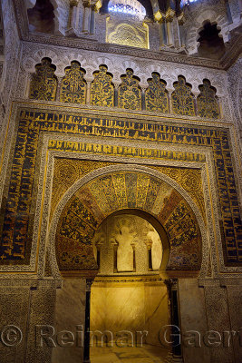 Mihrab qibla wall with gold mosaic design and caligraphy at the Prayer Hall of the Cordoba Cathedral Mosque