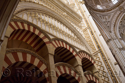 Double red and white arches of the Prayer Hall looking up to the main altar dome in the Cordoba Cathedral Mosque