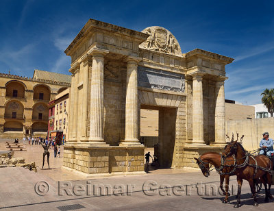 Horse drawn carriage at Puerta del Puente Roman Bridge Gate beside Cordoba Cathedral Mosque