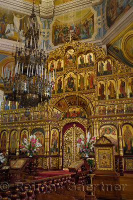 Interior of Ascension Cathedral in Almaty Kazakhstan with gold leaf iconostasis wall to the sanctuary