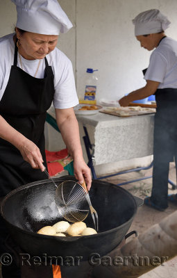 Preparation of Baursaki fried dough at the ethnic Kazakh village of the Huns Talgar Kazakhstan