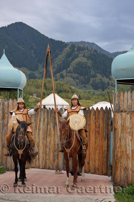 Guards on horseback at gate to Huns Ethno Village near Almaty Kazakhstan