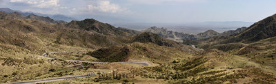 Panorama of highway A353 winding through Altyn Emel mountains to the National Park plain Kazakhstan