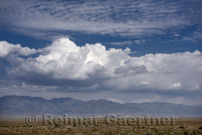Clouds over the steppe at Altyn Emel National Nature Park with Koyandy mountain Kazakhstan