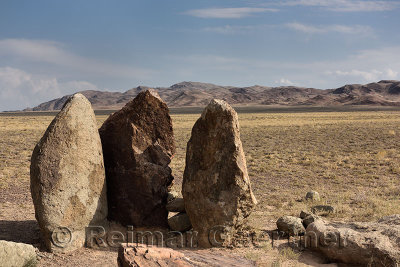 Mysterious Oshak Tas three standing stones in Altyn Emel National Park Kazakhstan