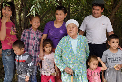 Extended Kazakh family at a rest stop from road trip to Altyn Emel National Park Kazakhstan