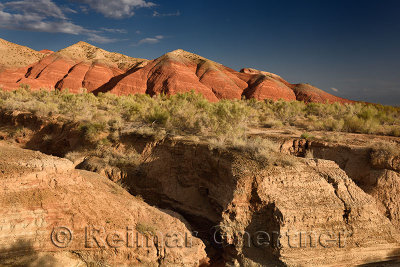 Dry stream bed with eroded clay at Aktau Mountains Altyn Emel National Park Kazakhstan