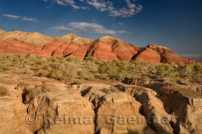 Dry stream bed with eroded clay at red Aktau Mountains Altyn Emel National Park Kazakhstan