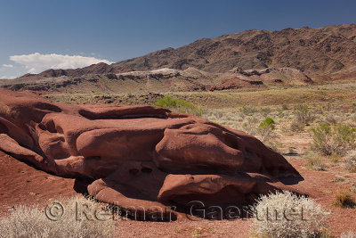 Outcrop of smooth shaped red lava rock at Katutau Mountains Altyn Emel National Park Kazakhstan