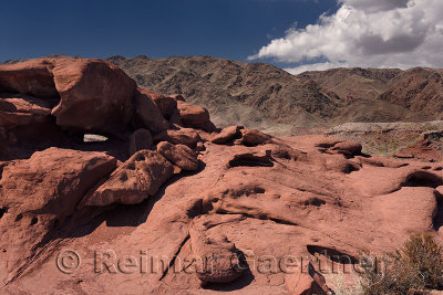 Eroded red lava rock shapes at Katutau Mountains Altyn Emel National Park Kazakhstan