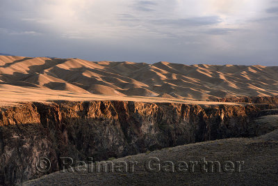 Sunset on rolling hills of Black Canyon South of Charyn Canyon National Park Kazakhstan