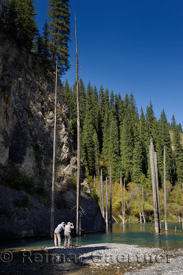 Photographers on Kaindy river Gorge to Kaindy Lake with Spruce trees Kazakhstan