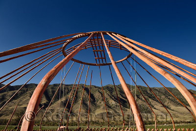 Wood frame of a Yurt roof being assembled with Kungey Alatau mountains Saty Kazakhstan
