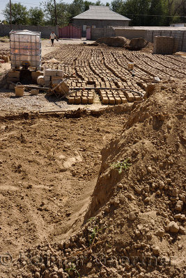 Onsite mudbrick manufacture for mud brick home construction near Shymkent Kazakhstan