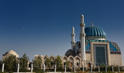 New Hoca Ahmet Yesevi Mosque with moonrise in Turkistan Kazakhstan