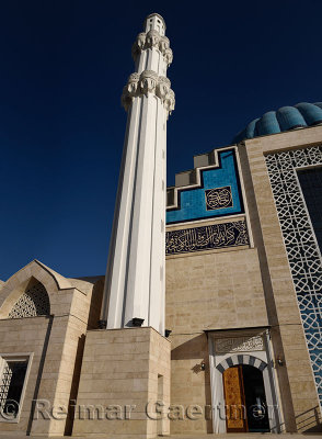 Blue sky and white minaret of Hoca Ahmet Yesevi Mosque in Turkistan Kazakhstan