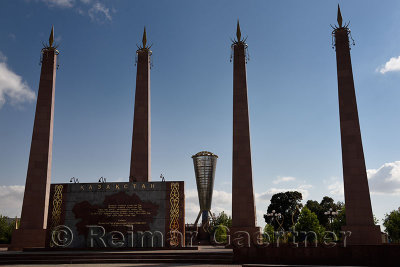 Backlit granite pillars and Altyn Shanyrak monument in Independence Park Shymkent Kazakhstan