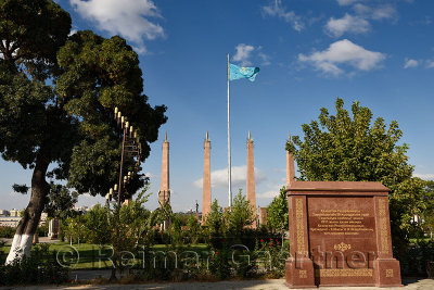 Granite memorial plaque and columns with Kazakh flag in Independence Park Shymkent Kazakhstan