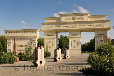 Ornate gates to Indepence Park Shymkent Kazakhstan with granite steles with 20 years history 1991 to 2011