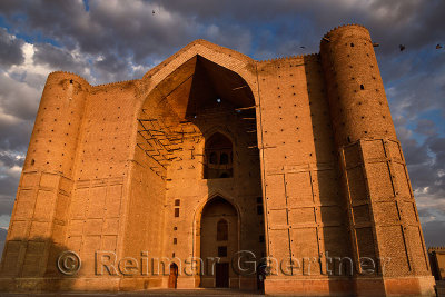 Red light on unfinished entrance of Khoja Ahmed Yasawi Mausoleum at dawn in Turkestan Kazakhstan
