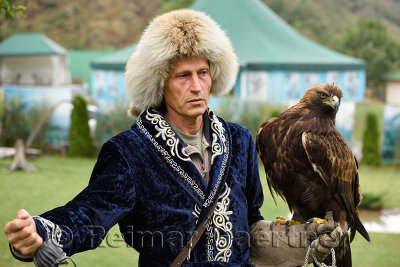 Professional trainer with Golden Eagle at Sunkar Raptor Center in Alma Arasan Gorge Almaty Kazakhstan