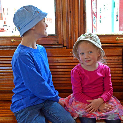 Mother and Daughter Riding in the Trolley