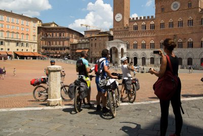 SIENA.Group of cyclists on the Place del Campo