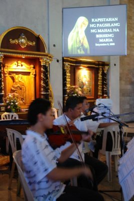 Musicians practice their repetoire before the mass