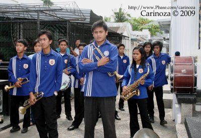 A somber-looking brass band