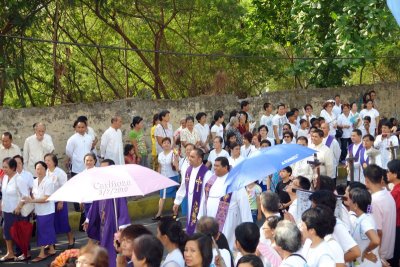 Processional group led by Team Ministry arrives at the faade of the present location of the parish