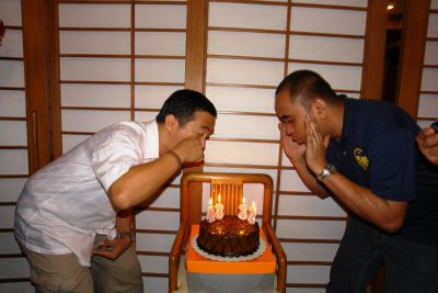 Mons Bart tries in vain to nose-blow out the candles (ick!)