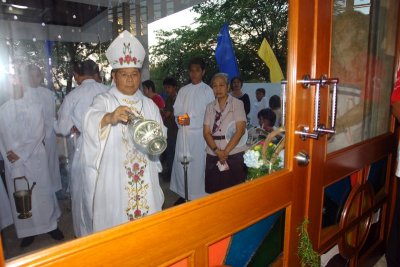 Bishop JF Oliveros before the newly-installed church door at the Main Entrance
