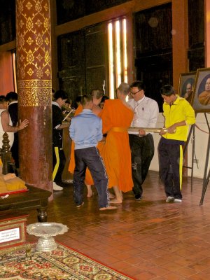 Young monk supervising.